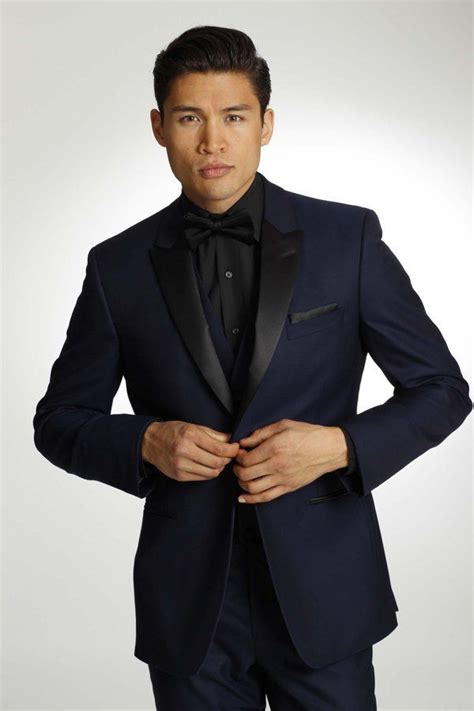 black tuxedo with blue shirt.